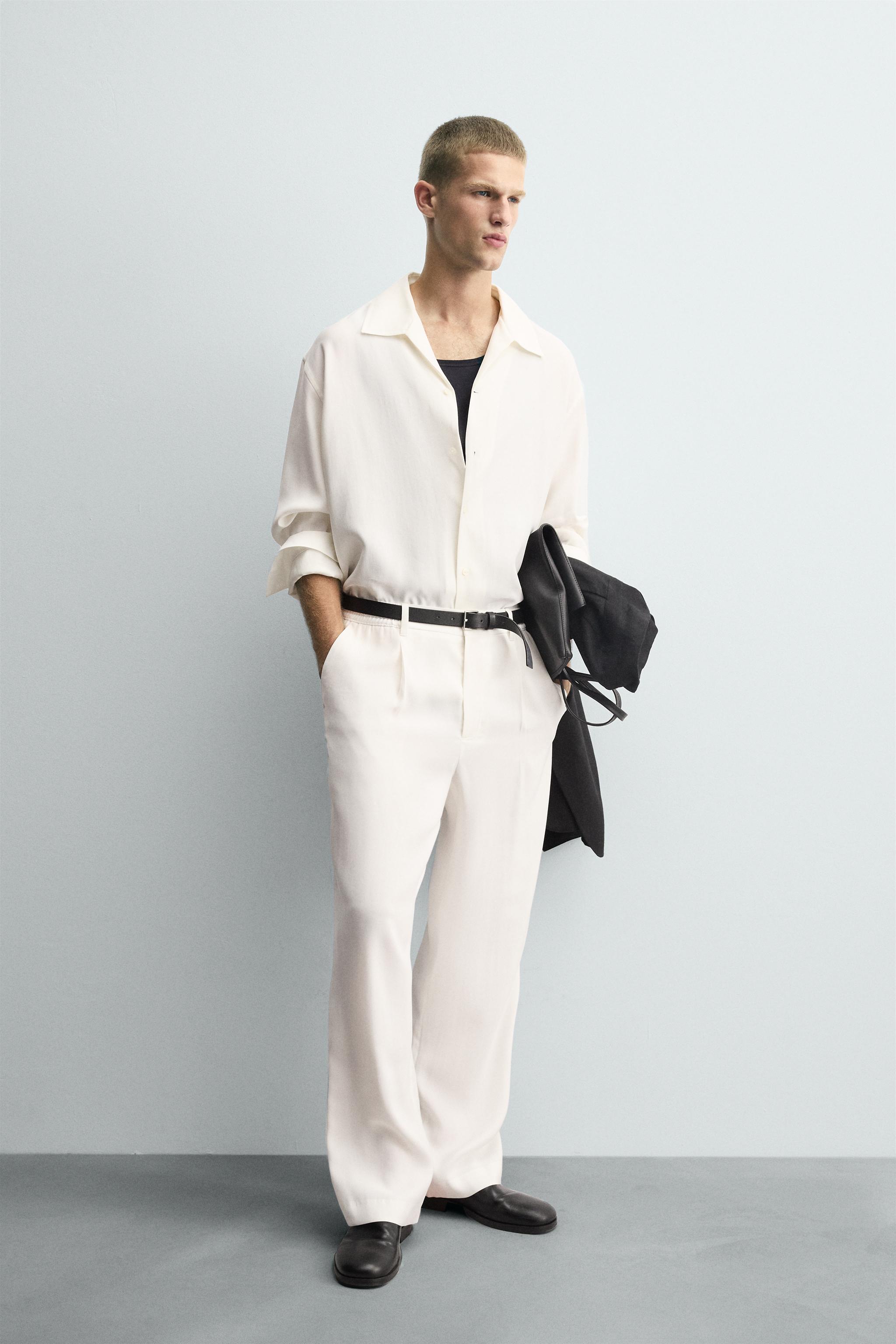 RELAXED FIT PLEATED PANTS